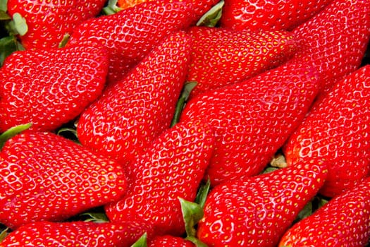 Red juicy strawberries closeup, background