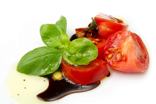 Fresh tomato and basil over olive oil and balsamic vinegar