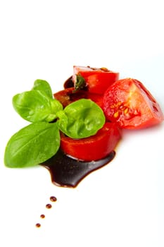 Fresh tomato and basil over olive oil and balsamic vinegar