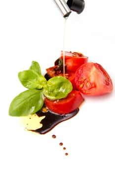 Fresh tomato and basil over olive oil and balsamic vinegar