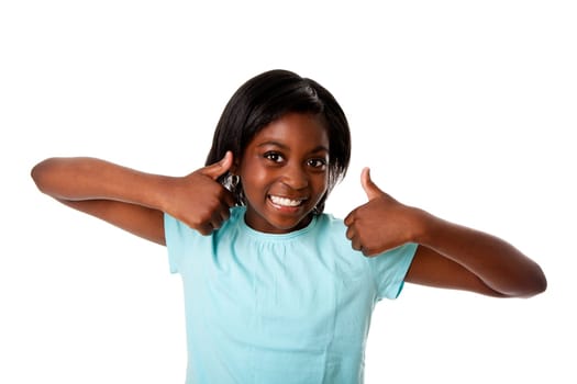 Beautiful happy teenager with two thumbs up smiling, isolated.