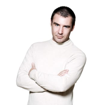 Portrait of a smart confident man with hands folded in studio on white isolated background