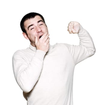 Portrait of a handsome expressive man yawing in studio on white isolated background