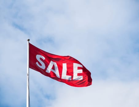 Sale flag flying in the wind