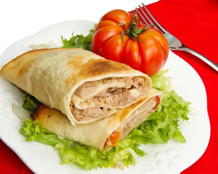 tuna sandwich on fresh salad and tomato
