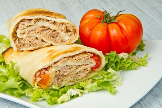 tuna sandwich on fresh salad and tomato
