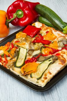 slice of pizza with fresh vegetables