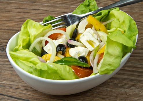 Feta salad with tomatoes, black olives  and fresh vegetables