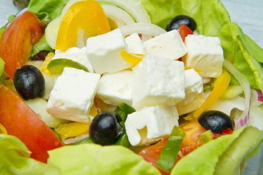 Feta salad with tomatoes, black olives  and fresh vegetables