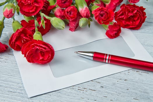 Spring letter and red carnation