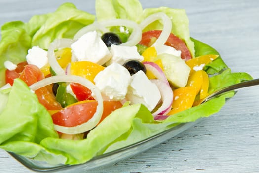 Feta salad with tomatoes, black olives  and fresh vegetables
