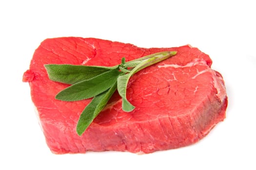 a red meat with sage and rosemary isolated on white background