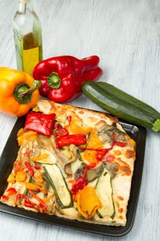 slice of pizza with fresh vegetables
