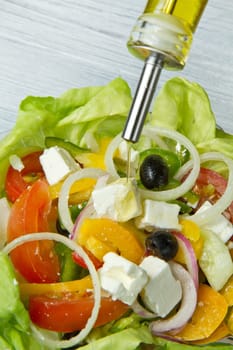 Feta salad with tomatoes, black olives  and fresh vegetables