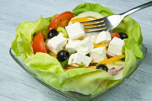 Feta salad with tomatoes, black olives  and fresh vegetables