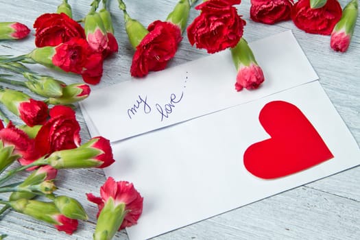 Spring letter and red carnation