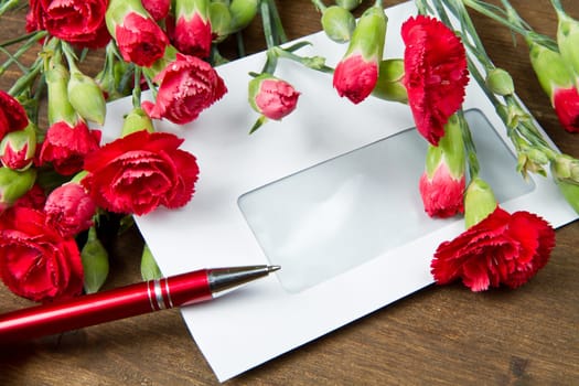 Spring letter and red carnation