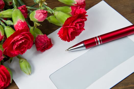 Spring letter and red carnation