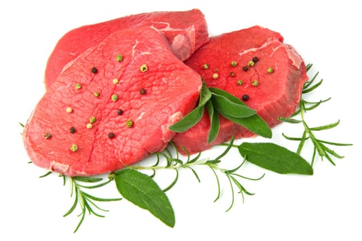 a red meat with sage and rosemary isolated on white background