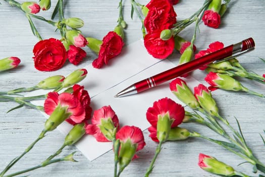 Spring letter and red carnation
