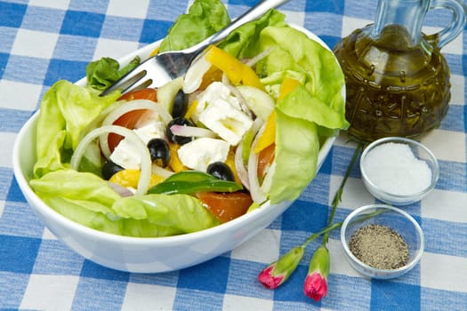 Feta salad with tomatoes, black olives  and fresh vegetables