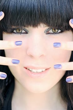 Purple nail polish and perfect make-up