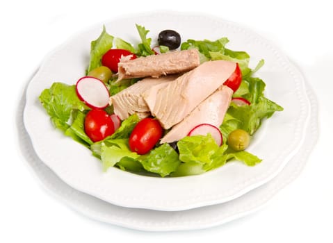 Tuna salad with tomatoes, olives and raddish