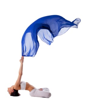 Young beauty woman in yoga asana and blue veil in air isolated
