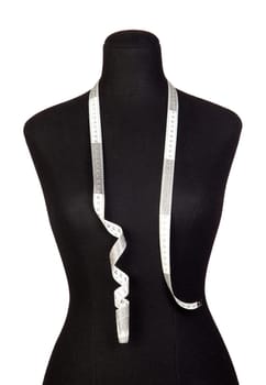 Mannequin with a tape measure a over white background