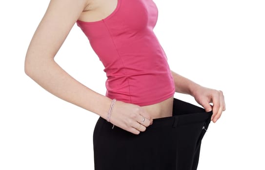 Thin girl after following a diet on a over white background