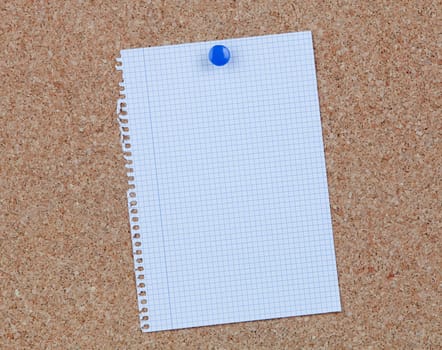 Cork bulletin board with blank paper hanging