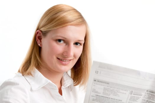 Young woman reading the newspaper