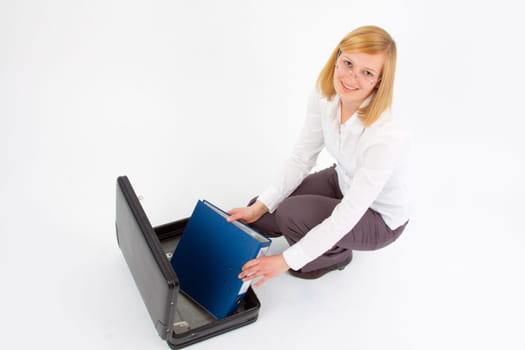Young woman with briefcase and folder