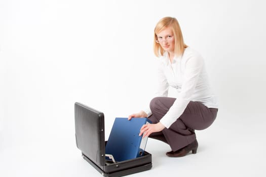 Young woman with briefcase and folder