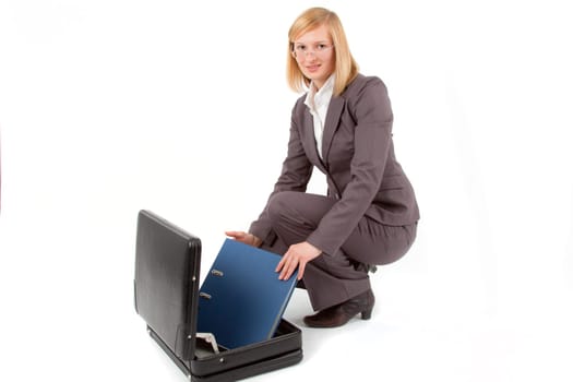 Young woman with briefcase and folder