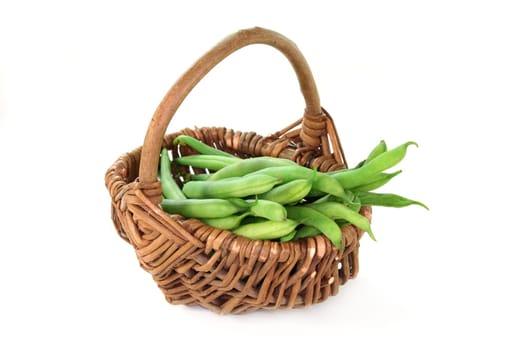 fresh green beans against white background