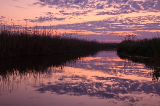 reflection of clouds on the lake at sunrise