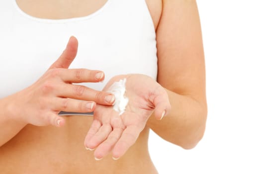Woman in underwear applies cream on dry hands