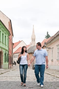 Young couple walking in old town of Bratislava (capital of Slovakia)