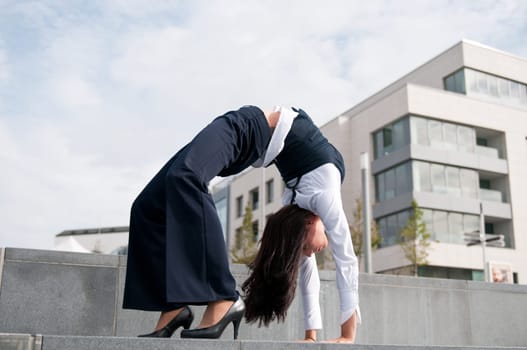 Flexibility - business woman outdoors