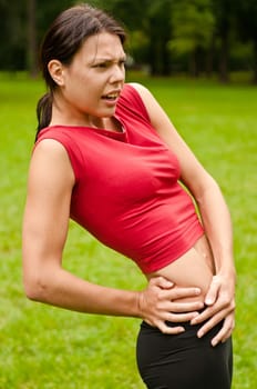 Buttocks injury - sportswoman in pain