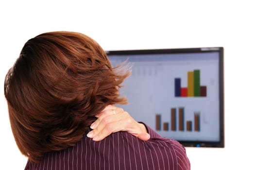 Business person with neck pain behind computer monitor