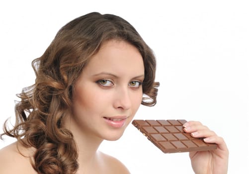 Young beautiful sensual woman holding bar of chocolate isolated on white background