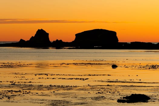 Nice picture of a sunset low tide in ocher