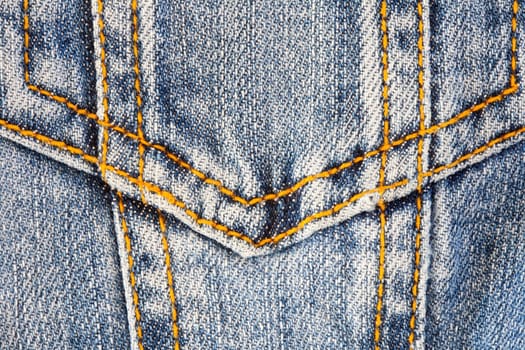 Photo of a pocket jeans with yellow thread