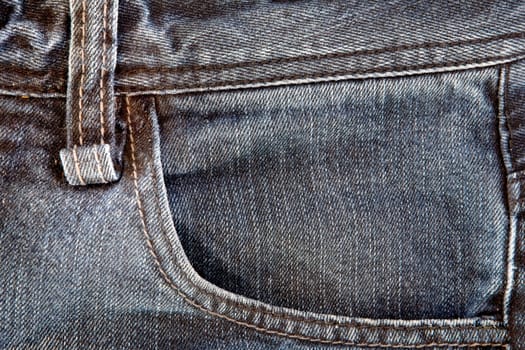 Photo of a pocket jeans with yellow thread