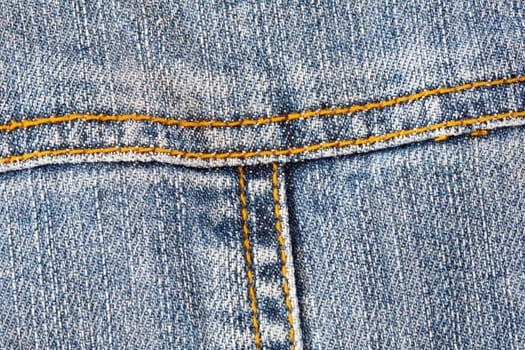 Detail of pocket jeans with yellow thread