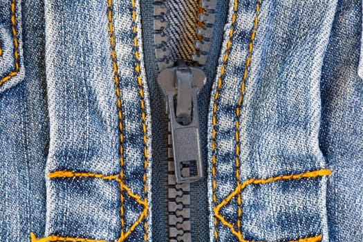 Detail of jeans jacket with a zipper