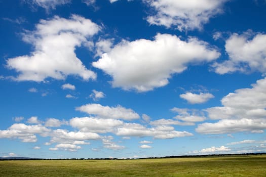 Landscape with a beautiful blue cloudy sky
