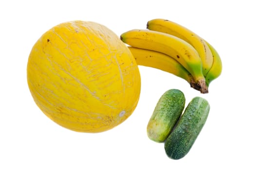 Melon yellow, two green cucumbers and bananas. Healthy Eating